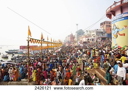 Stock Image - Crowd of pilgrims at the ghats on the ganges; Varanasi, India. Fotosearch