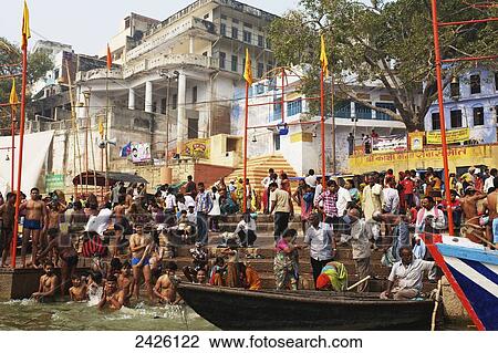 Stock Image - Crowd of pilgrims at the ghats on the ganges; Varanasi, India. Fotosearch