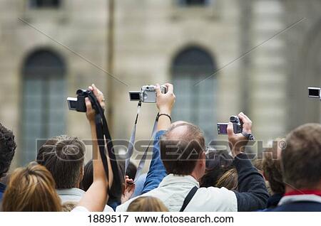 Crowd Of Tourist With Digital Cameras And Video Cameras. View Large Photo Image Stock Photo - Crowd Of Tourist With Digital Cameras And Video Cameras.. Fotosearch