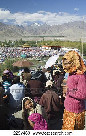 Stock Photo - Crowds at the Dalai Lama's teachings. The Dalai Lama spent four days of August in Leh, Ladakh. Ladakh is a Buddhist enclave in northern India.. Fotosearch