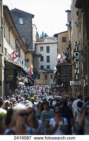 Stock Photo - Crowds of tourists near the Ponte Vecchio, or Gold Bridge; Florence, Italy. Fotosearch