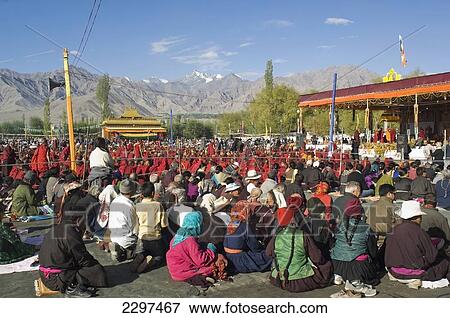 Stock Photo - Crowds wait for the Dalai Lama. The Dalai Lama spent four days of August in Leh, Ladakh. Ladakh is a Buddhist enclave in northern India.. Fotosearch