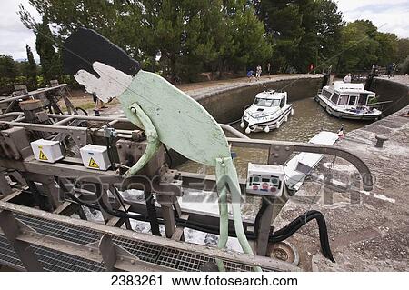 Cruise boats at the Aiguille lock on the popular Canal du Midi; France View Large Photo Image Stock Image - Cruise boats at the Aiguille lock on the popular Canal du Midi; France. Fotosearch