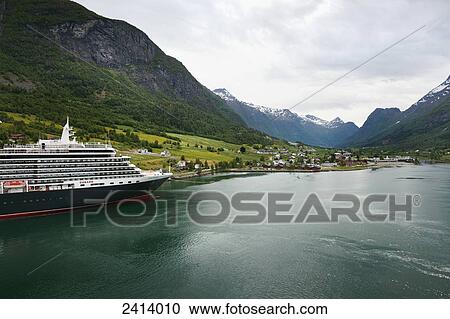 Stock Image - Cruise ship in Nordfjorden; Olden, Norway. Fotosearch