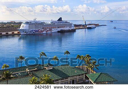 Stock Image - Cruise ship in the port at Honolulu harbour; Honolulu, Oahu, Hawaii, United States of America. Fotosearch