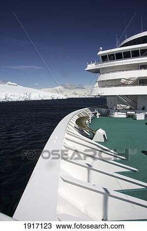 Stock Image - Cruise Ship Sailing Through Antarctic. Fotosearch