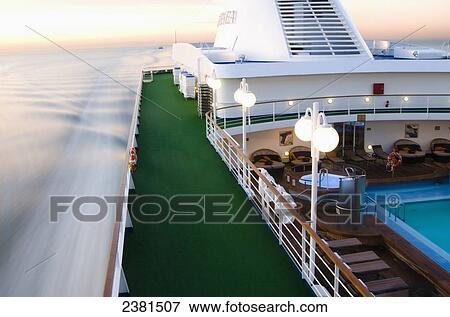 Cruise ship sailing towards New York in the early morning; New York City, New York, United States of America View Large Photo Image Stock Photo - Cruise ship sailing towards New York in the early morning; New York City, New York, United States of America. Fotosearch