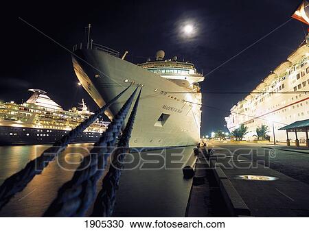 Cruise Ships In Nassau Harbour At Night, Boats With Moorings And Ropes, Bahamas. View Large Photo Image Stock Image - Cruise Ships In Nassau Harbour At Night, Boats With Moorings And Ropes, Bahamas.. Fotosearch