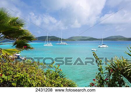 Crystal blue waters and sailboats anchored off Necker Island; Neck Island, British Virgin Islands View Large Photo Image Stock Photo - Crystal blue waters and sailboats anchored off Necker Island; Neck Island, British Virgin Islands. Fotosearch