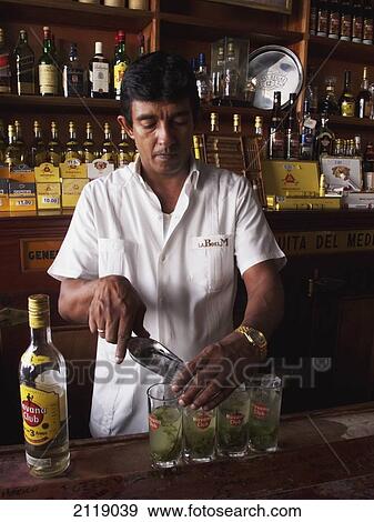 Stock Photo - Cuba, Front view of bartender; Havana. Fotosearch