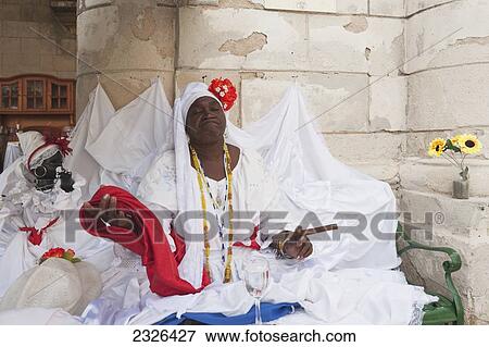 Stock Photo - Cuba, Local Cuban character smoking a cuban cigar; Havana. Fotosearch