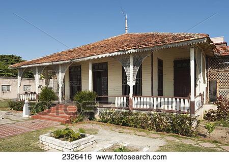 Stock Photograph - Cuba, Old timber house on the waterfront; Cienfuegos. Fotosearch