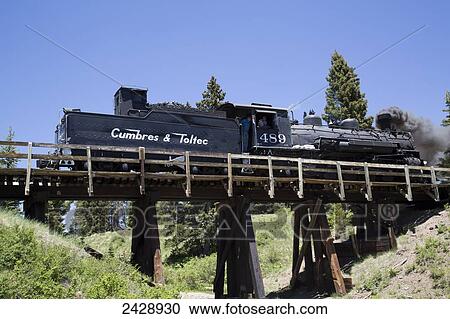 Stock Image - Cumbres and Toltec Scenic Railroad with steam powered locomotive; New Mexico. Fotosearch