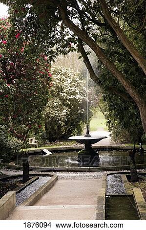Picture - Cumbria, England; A Water Fountain In The Gardens At Holker Hall. Fotosearch