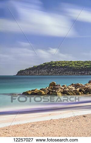 Stock Photo - Cumulus clouds over Dickenson Bay; St. John's, Antigua, West Indies. Fotosearch