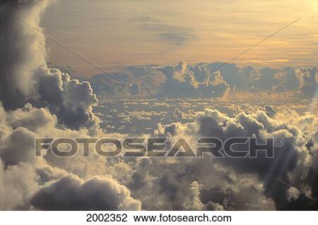 Cumulus Clouds View From Airplane, Soft Lighting At Sunset View Large Photo Image Stock Image - Cumulus Clouds View From Airplane, Soft Lighting At Sunset. Fotosearch