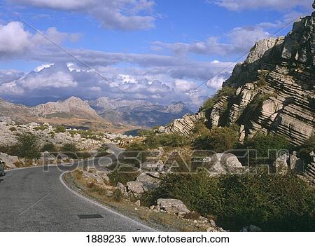 Stock Photography - Curved Empty Road In Torcal National Park. Fotosearch