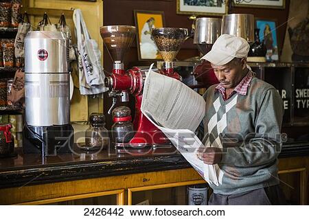 Customer reading the paper in Tomoca coffee house; Addis Ababa, Ethiopia View Large Photo Image Stock Image - Customer reading the paper in Tomoca coffee house; Addis Ababa, Ethiopia. Fotosearch