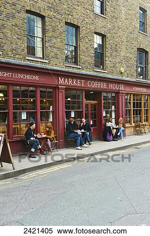 Customers sit at tables outside Market Coffee House, Spitalfields; London, England View Large Photo Image Stock Photography - Customers sit at tables outside Market Coffee House, Spitalfields; London, England. Fotosearch