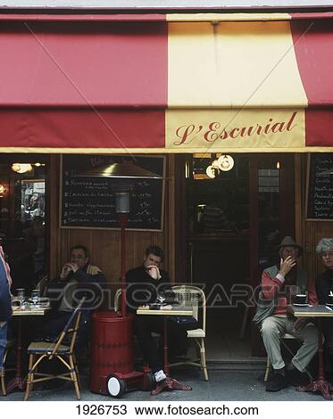 Stock Image - Customers Sitting Outside A Restaurant In The Marais (L'escurial). Fotosearch