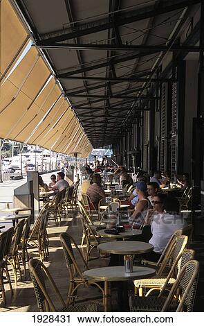 Stock Image - Customers Sitting Outside Restaurant; Sydney, New South Wales, Australia. Fotosearch