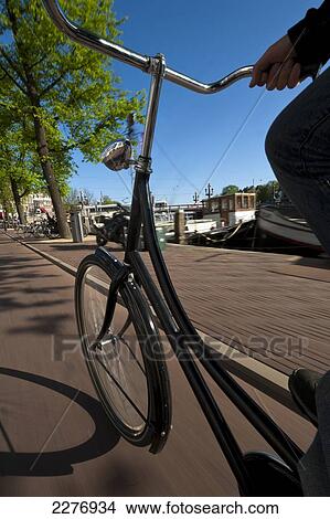 Cycling down cycle path; Amsterdam, Holland View Large Photo Image Picture - Cycling down cycle path; Amsterdam, Holland. Fotosearch