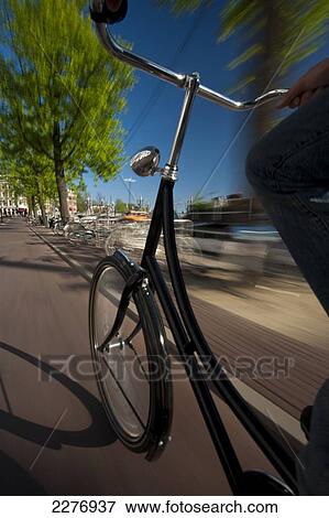 Cycling down cycle path; Amsterdam, Holland View Large Photo Image Stock Photo - Cycling down cycle path; Amsterdam, Holland. Fotosearch