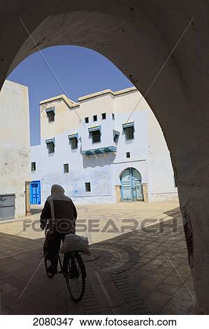 Cycling In City Back Streets; Kairouan, Tunisia, North Africa View Large Photo Image Stock Photo - Cycling In City Back Streets; Kairouan, Tunisia, North Africa. Fotosearch