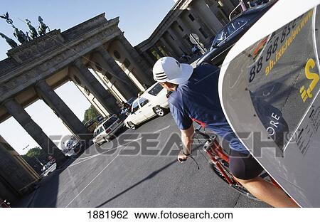 Cyclist And Brandenburg Gate View Large Photo Image Stock Image - Cyclist And Brandenburg Gate. Fotosearch