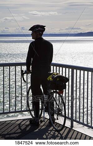Cyclist On Bell Street Pier; Seattle, Washington State, Usa View Large Photo Image Picture - Cyclist On Bell Street Pier; Seattle, Washington State, Usa. Fotosearch