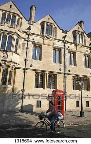 Picture - Cyclist Passing University Buildings; Oxford, England. Fotosearch