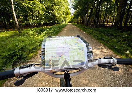 Stock Photo - Cyclist With Map Following A Cycle Route Around Brockenhurst, New Forest National Park. Fotosearch