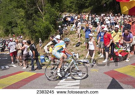 Stock Photography - Cyclists and fans at the Tour de France; Pyrenees, France. Fotosearch