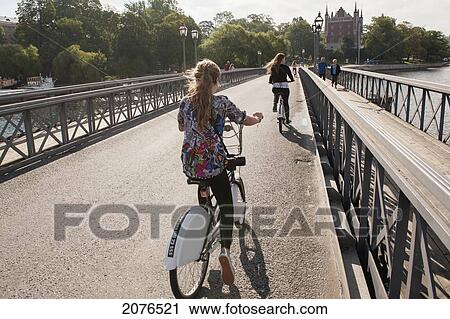 Cyclists And Pedestrians On A Path Going Over Water; Stockholm Sweden View Large Photo Image Stock Image - Cyclists And Pedestrians On A Path Going Over Water; Stockholm Sweden. Fotosearch