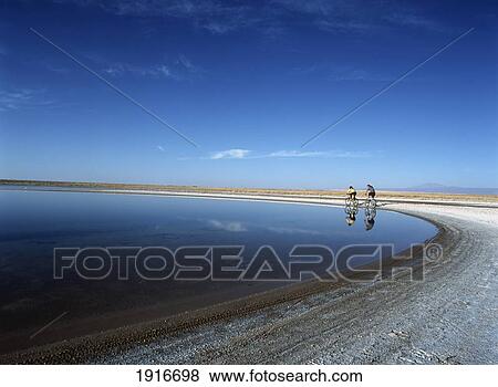 Stock Photo - Cyclists At The Laguna De Cejar. Fotosearch