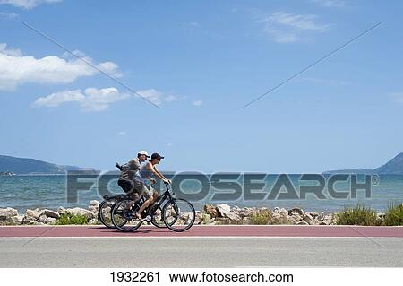 Cyclists In S'albufereta, A Natural Reserve Between Alcudia And Badia De Pollenca, Mallorca, Balearic Islands, Spain View Large Photo Image Stock Image - Cyclists In S'albufereta, A Natural Reserve Between Alcudia And Badia De Pollenca, Mallorca, Balearic Islands, Spain. Fotosearch