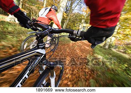 Cyclists On Track In Autumn View Large Photo Image Stock Photo - Cyclists On Track In Autumn. Fotosearch