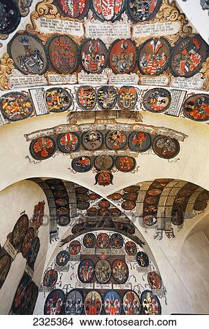 Picture - Czech Republic, Colorful crests displayed on curved ceiling and walls; Prague. Fotosearch