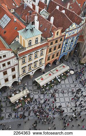 Stock Image - Czech Republic, Elevated view of crowd in town square; Prague. Fotosearch