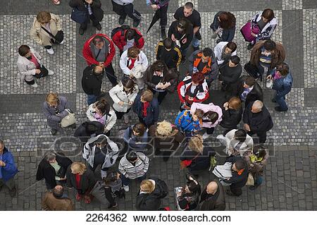 Stock Image - Czech Republic, Elevated view of group of tourists; Prague. Fotosearch
