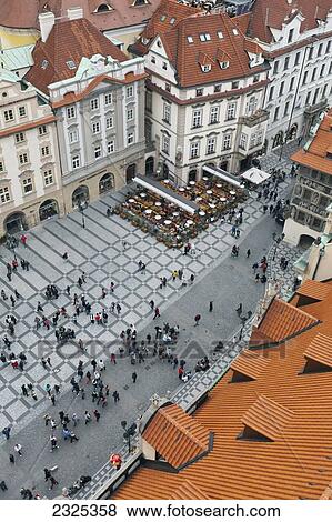 Stock Photo - Czech Republic, High angle view of pedestrians in town square; Prague. Fotosearch