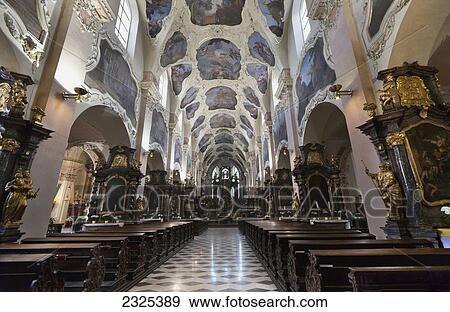 Stock Photo - Czech Republic, Interior of church with view down aisle; Prague. Fotosearch