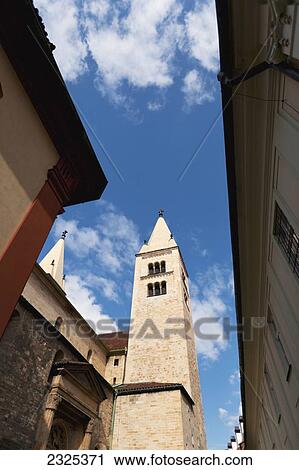 Czech Republic, Low angle view of buildings against blue sky with cloud; Prague View Large Photo Image Stock Image - Czech Republic, Low angle view of buildings against blue sky with cloud; Prague. Fotosearch
