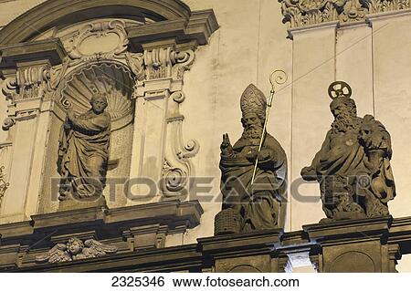Stock Photograph - Czech Republic, Statues and ornate facade of building; Prague. Fotosearch
