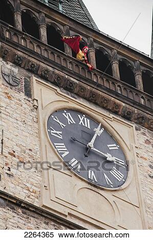 Stock Photography - Czech Republic, Trumpet player waving to people from Town Hall tower; Prague. Fotosearch