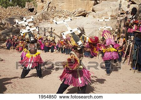 Stock Image - Dancers wearing Kananga masks perform at the Dama celebration in Tireli, Mali. Fotosearch