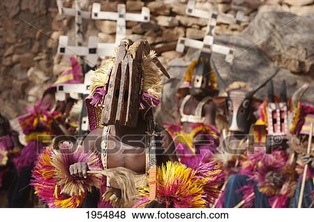 Dancers wearing Kananga masks perform at the Dama celebration in Tireli, Mali View Large Photo Image Stock Photo - Dancers wearing Kananga masks perform at the Dama celebration in Tireli, Mali. Fotosearch