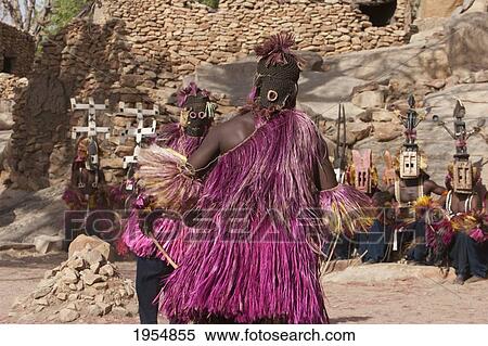 Stock Photography - Dancers wearing Kananga masks perform at the Dama celebration in Tireli, Mali. Fotosearch