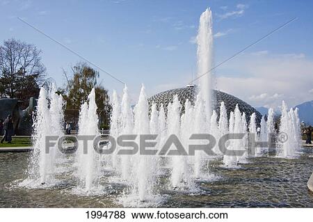 Stock Photo - Dancing Fountain Comprised Of 70 Jets On The Plaza In Front Of The Bloedel Floral Conservatory, Triodetic Dome Capping Queen Elizabeth Park, Vancouver, British Columbia, Canada. Fotosearch