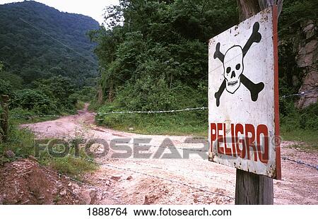 Picture - Danger Sign With Skull And Crossbones. Fotosearch